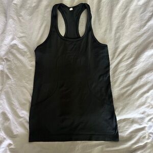 Women’s Lululemon black swiftly tech racerback hip length tank top size 6